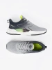 Šedé sportovní boty se zelenými prvky